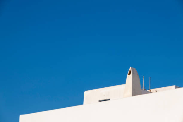 Detail of traditional mediterranean house with blue sky in the background.