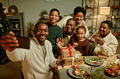 istock African American Family Taking Selfie at Christmas 1358090859