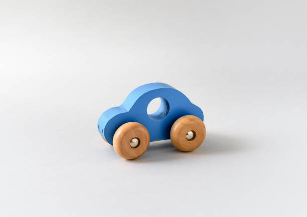 istock Blue wooden toy car on a white seamless background 1358091306