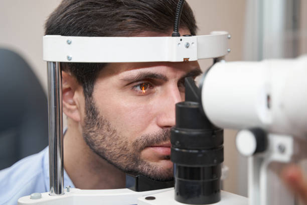 istock Male patient undergoing check of eyes with slit lamp 1358091522