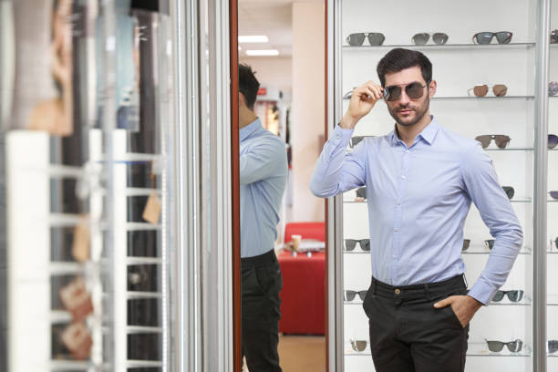 istock Caucasian man staring ahead while wearing sunglasses 1358091662