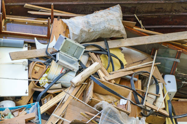 istock Many old home appliances and furniture in garbage container. 1358092246