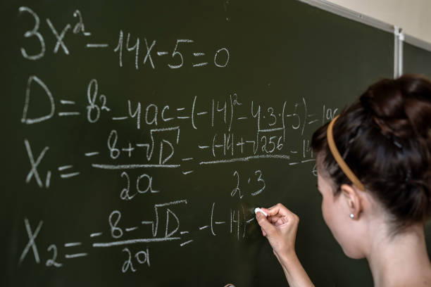 istock young female student written math formulas on the chalkboard 1358094431