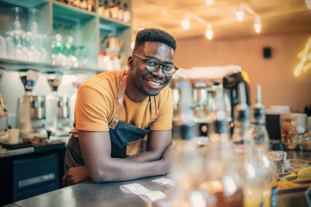 istock Portrait of happy bartender 1358094971