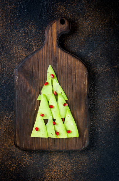 istock Assorted cheese pieces laid out in the form of a Christmas tree 1358096052