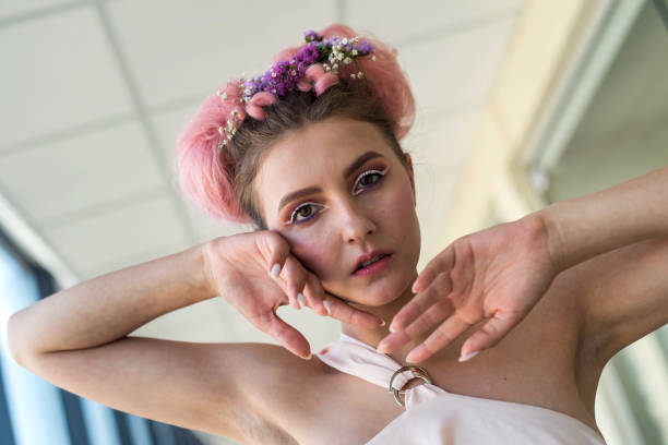 istock attractive woman posing with hands near face 1358096136