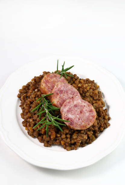 cotechino with lentils. christmas and holiday season. - cooked vertical high angle view lentil imagens e fotografias de stock