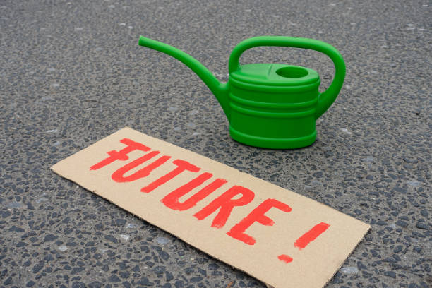 istock Environmental protection protest sign and watering can 1358098397