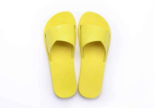 istock Yellow slippers on a white background. 1358098447