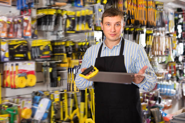 istock Ordinary seller in apron at the showcase 1358098592