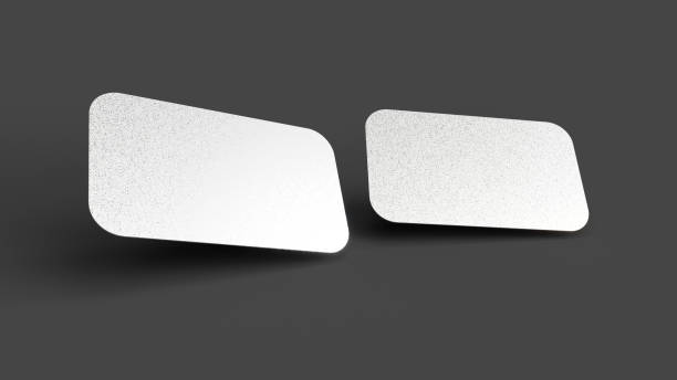 istock Silver Foil blank business cards on a dark floor. 3d rendering 1358098647