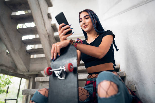 istock Young hipster woman, using mobile phone 1358099225