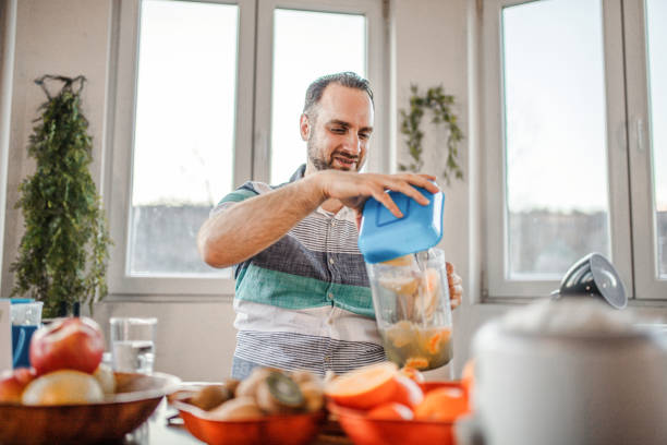 istock Young doctor making a video about importance of implementing fruit in everyday diet 1358101058