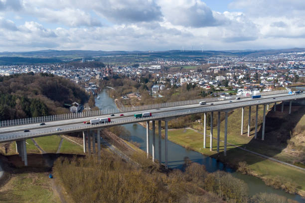istock Highway and railroad bridge - aerial view 1358101322