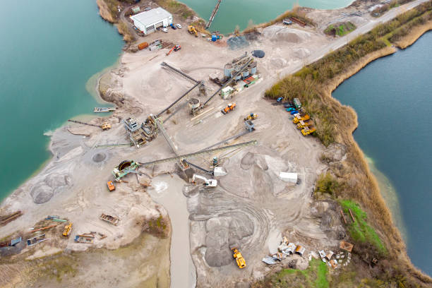 istock Sand and gravel pit, lake - aerial view 1358101344