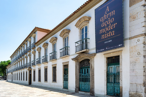 Rio de Janeiro, Brazil - December 02, 2021: Facade of the Imperial Palace in the old town of the city. A sign is announcing a new exhibit about modernism in Brazil