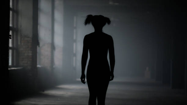 istock Athletic woman walking in loft building. Girl taking break between training 1358101583