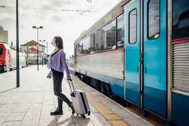 istock Young women left the train, standing on the platform ready for adventure 1358102619