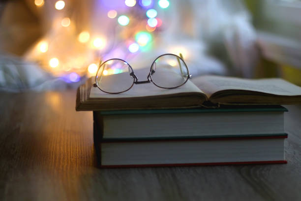 istock Book, Glasses and Colorful Bokeh 1358102843