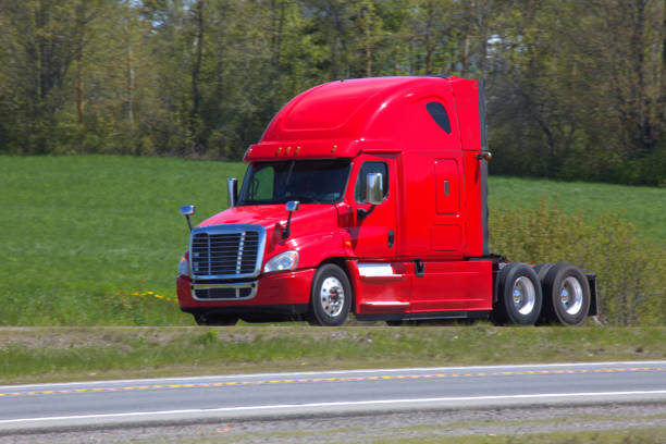 istock Red Semi-truck on a highway 1358104378