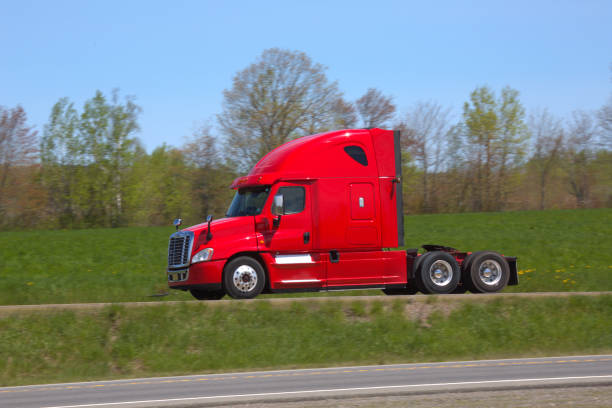 istock Red Semi-truck on a highway 1358104962