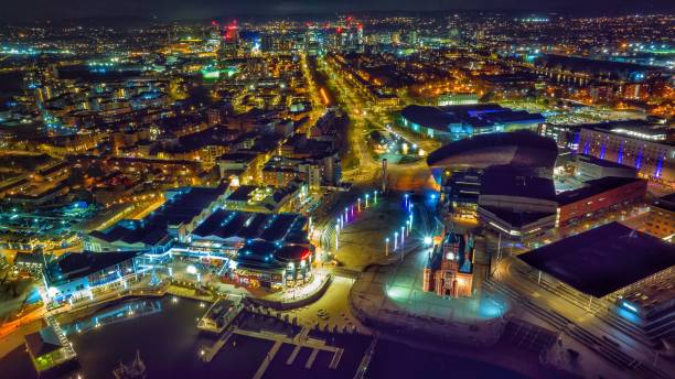 Aerial view of cardiff bay at night Night time view of Cardiff bay Mermaids Quay at night with bright lights cardiff wales stock pictures, royalty-free photos & images
