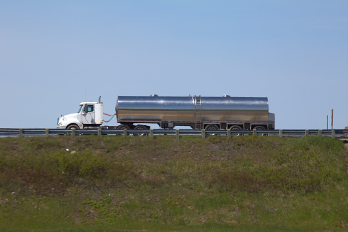 Semi-truck tanker delivering its load.c