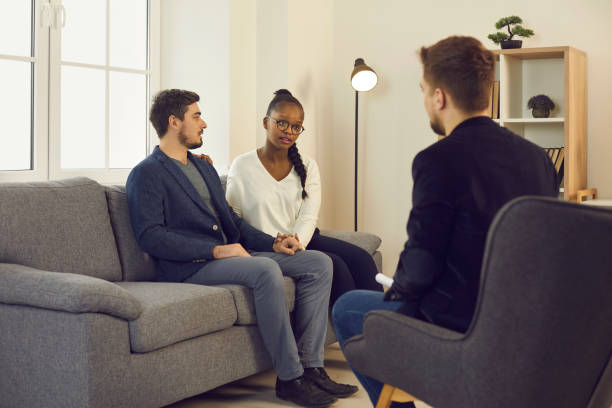 istock Young couple asking therapist or psychologist to help them with relationship problem 1358108289