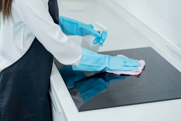 istock asian woman housekeeper clean kitchen. 1358109058