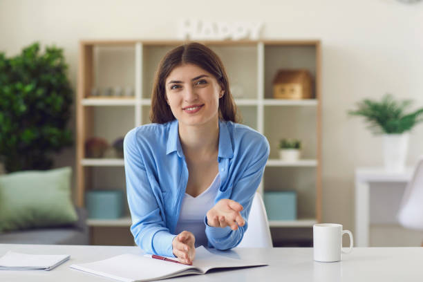 istock Smiling woman explaining project for colleague 1358110449