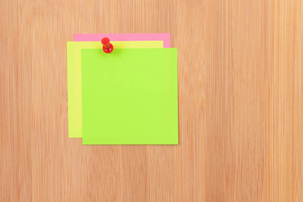 istock Colored Sticky Notes Pinned to the Wooden Message Board 1358113281