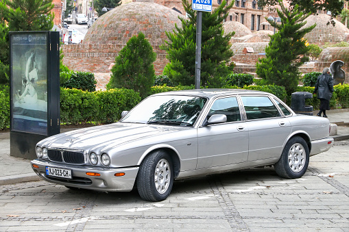 Tbilisi, Georgia - October 10, 2021: British luxury car Jaguar XJ in a city street.