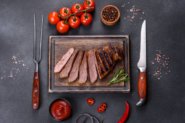 istock Cooked grilled Chuck eye roll steak on a chopping Board 1358114992