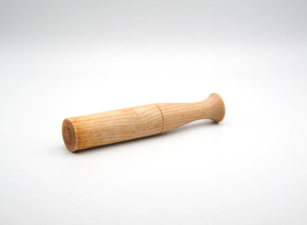 istock Wooden pestle on white background 1358115981