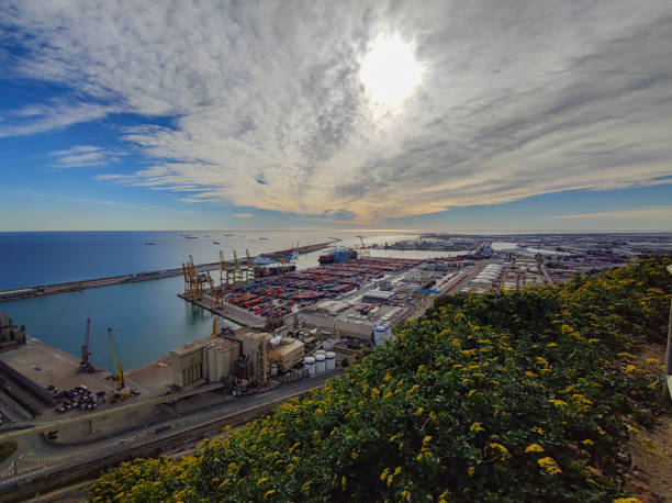 mediterranean and european city barcelona and a view over the harbor with lots of cargo. industrial - port de barcelona imagens e fotografias de stock