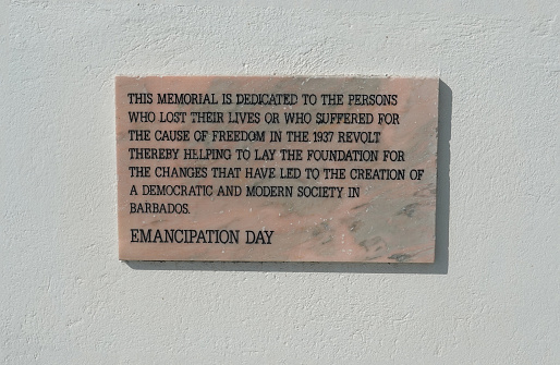 Bridgetown, Barbados, Nov 2021.  Plaque depicting Emancipation day on a whitewashed wall.  Barbados celebrated becoming a republic country and was celebrated throughtout the country