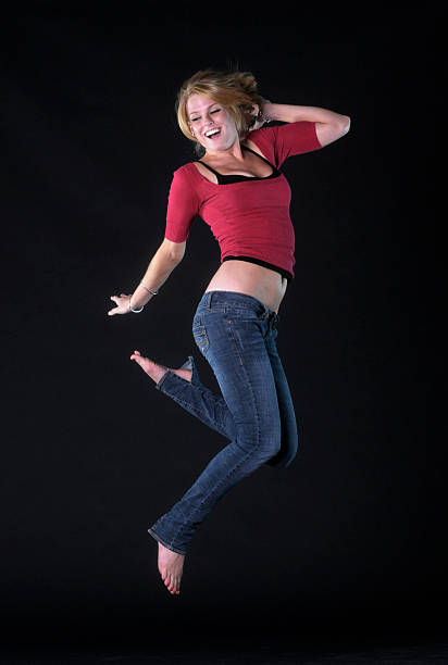 istock Young woman jumping 135812500