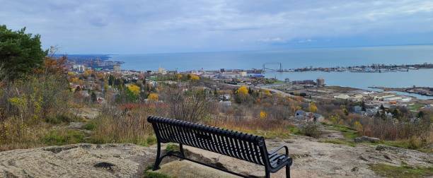 View From a Hilltop of an Urban Area and Blue Waters in the Distance stock photo