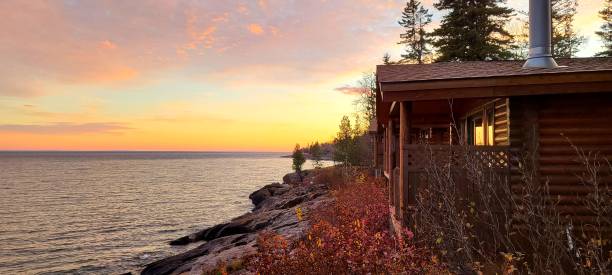istock Cozy Log Cabin at Sunset with a Dreamy Horizon View 1358127376
