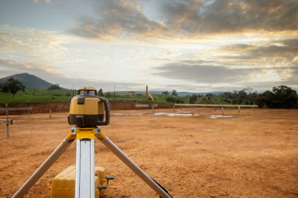 Electronic laser level Electronic laser level on domestic building site. tacheometer stock pictures, royalty-free photos & images