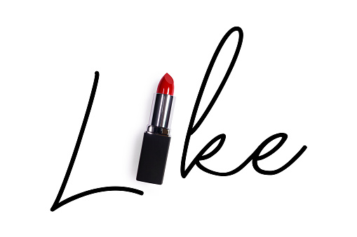 Creative fashion beauty concept photo of lipstick with sign text font on white background.