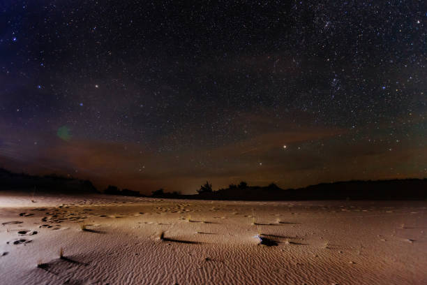 The sandy desert landscape at starry night The sandy desert landscape at starry night. oasis sand sand dune desert stock pictures, royalty-free photos & images