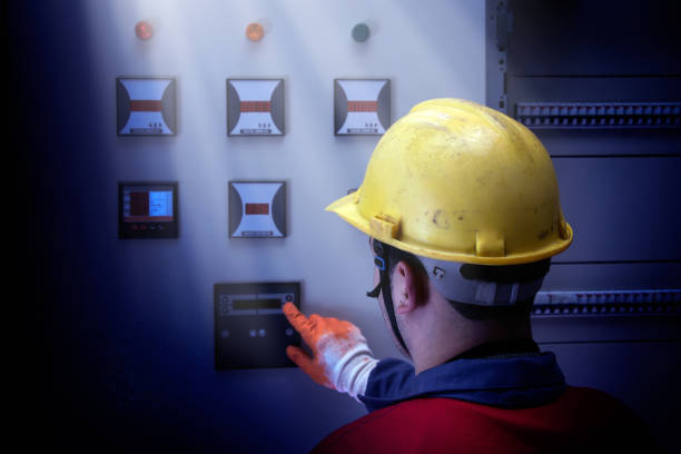 istock Close up electrician working on electric panel 1358132294