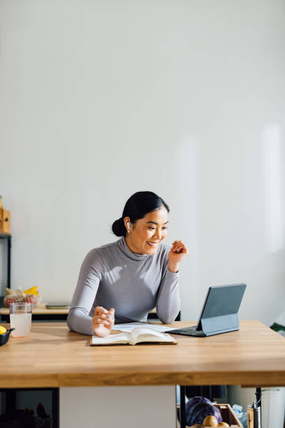Smiling Woman Talking on a Video Call at Home