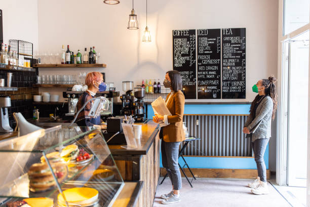 istock Woman customer ordering at cafe during COVID-19 1358132526