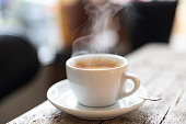 istock Refreshing hot cup of coffee at a cafe 1358132613