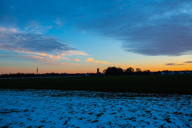 TV tower and 02 tower with sunset in Munich