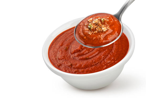 istock Bowl of tomato soup isolated on white background 1358139953