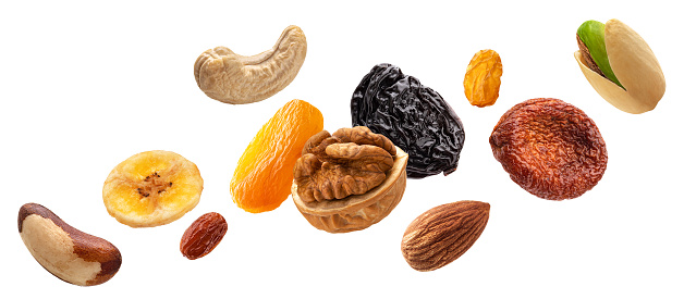 Collection of nuts and dried fruits isolated on white background with clipping path