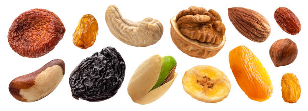 Set of nuts and dried fruits isolated on white background Collection of nuts and dried fruits isolated on white background with clipping path dried fruit stock pictures, royalty-free photos & images